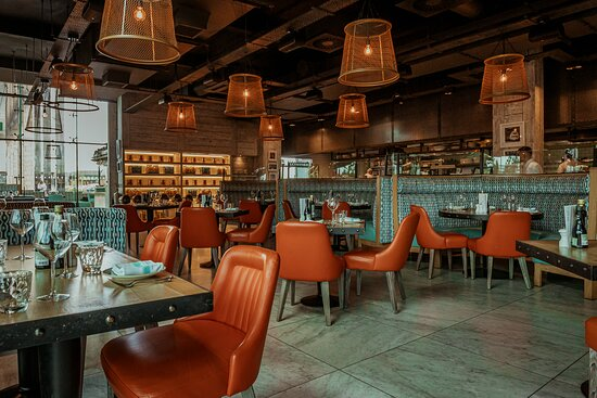 Restaurant interior with orange chairs